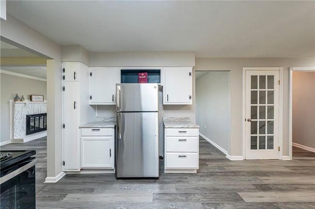 A pantry for storage needs and area above the fridge for cookbooks, baskets, to display your favorite pieces...you decide! | Image 15
