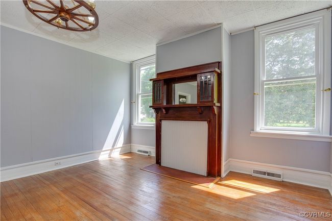 Entrance foyer with light wood finished floors, decorative columns, and baseboards | Image 10