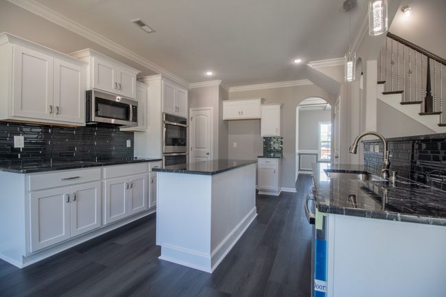 EXAMPLE>>>Large Kitchen with a Cooktop, SMART Double Oven, Granite Countertops, Tile Backsplash, Recessed Lighting, Bar Area and Lots of Cabinetry - All with Soft Close Doors & Drawers!! | Image 7