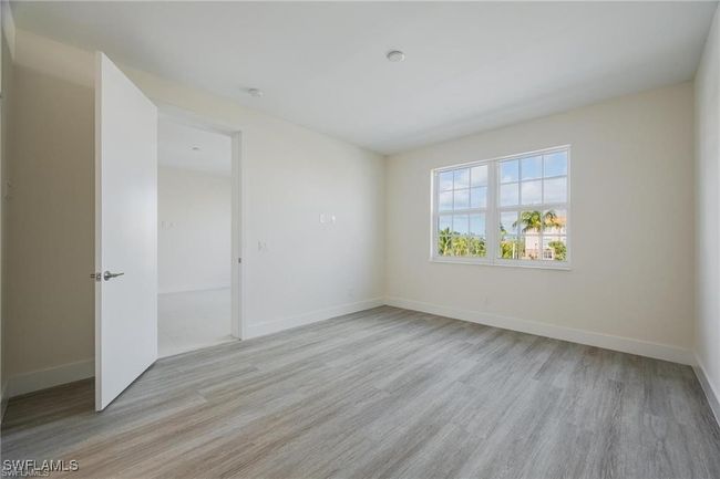 Unfurnished room with baseboards and light wood finished floors | Image 20