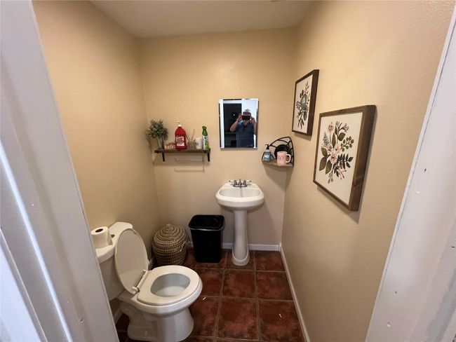 Bathroom with toilet, tile patterned floors, and baseboards | Image 25