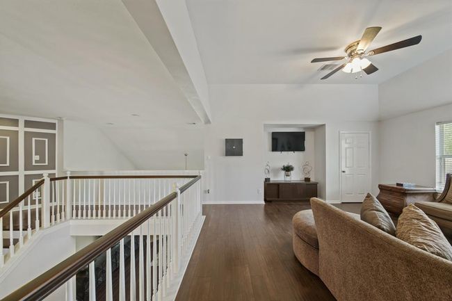 Overlooking the main living area, the expansive game room offers a flexible space for movie nights, gaming, or relaxing with family. | Image 31