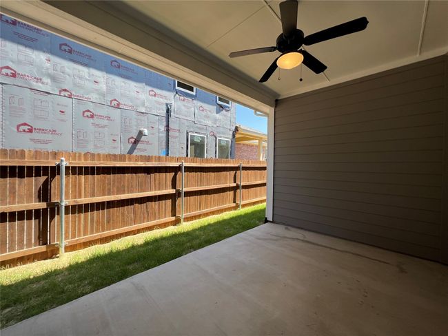 View of patio / terrace featuring ceiling fan | Image 12