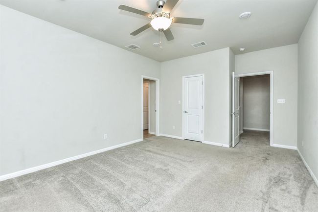 Bathroom with a shower stall, double vanity, wood finished floors, and recessed lighting | Image 15
