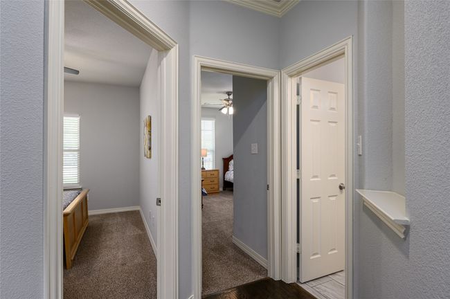 Hall with light carpet and plenty of natural light | Image 11