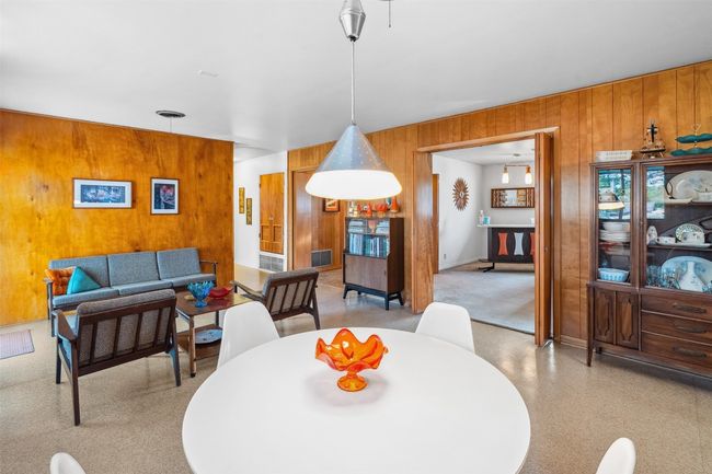 Dining area featuring wooden walls | Image 22