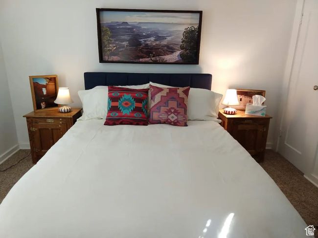 Bedroom featuring baseboards and carpet floors | Image 9
