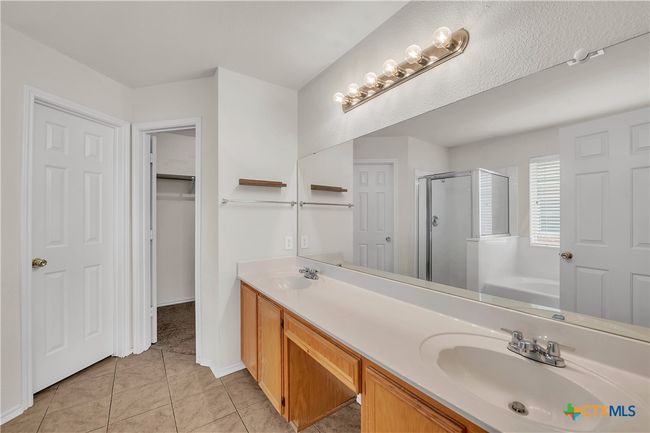 Primary Bathroom Dual Sinks, dedicated vanity space, walk in closet | Image 18