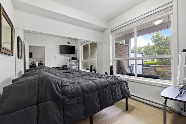 Carpeted bedroom with baseboard heating | Image 28