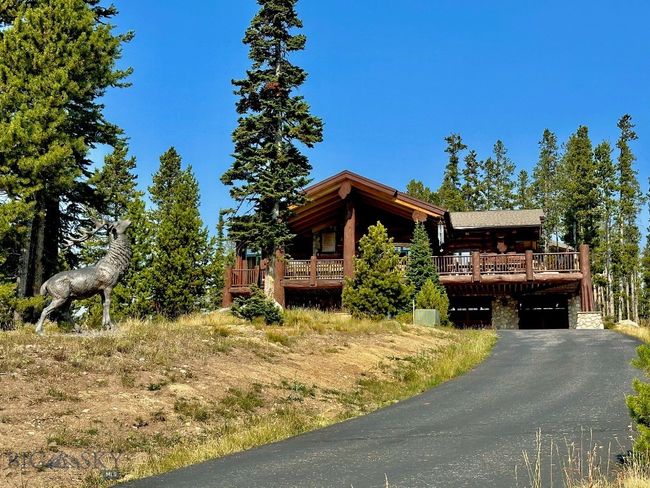 Summer view of home and elk statue from driveway. | Image 94