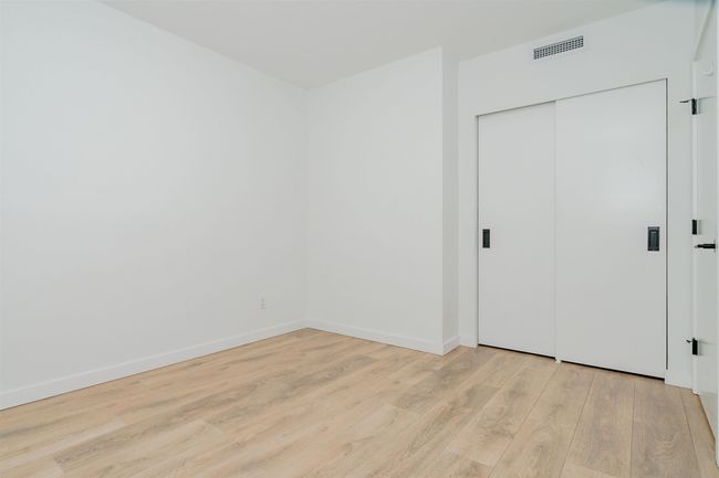 Unfurnished bedroom featuring visible vents, baseboards, a closet, and light wood-style floors | Image 22