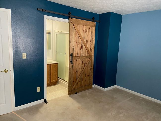 Bathroom featuring a sink and baseboards | Image 8