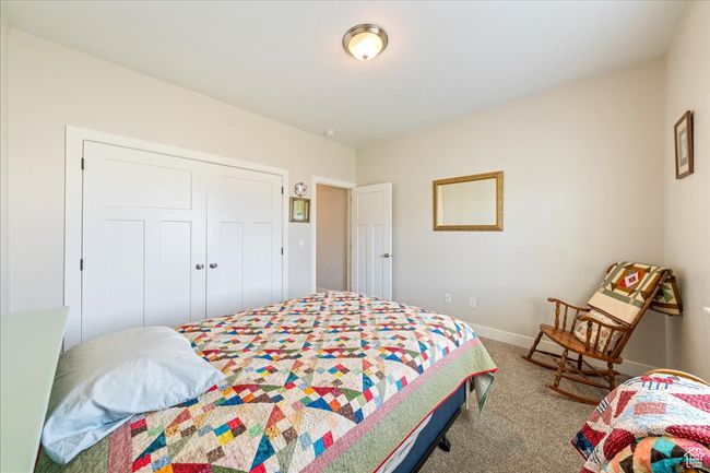 Carpeted bedroom featuring baseboards and a closet | Image 30
