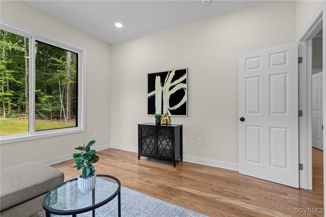 Living area featuring plenty of natural light, light wood finished floors, and recessed lighting | Image 23