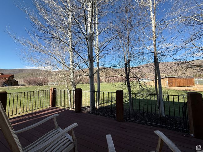 Wooden deck with a lawn and a mountain view | Image 82