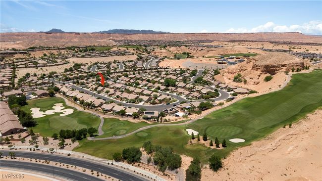 Aerial overview of property's location featuring a mountain backdrop, a golf course, and nearby suburban area | Image 49
