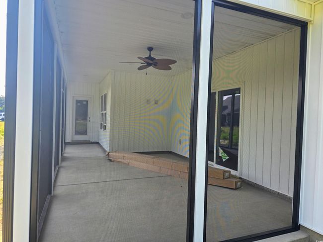 View of patio with a ceiling fan | Image 34