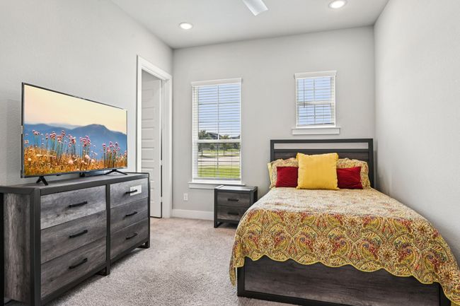 Bedroom featuring multiple windows, light colored carpet, and recessed lighting | Image 15
