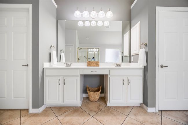Primary bedroom ensuite features dual sinks, 2 linen closets and spacious walk in closet. | Image 15