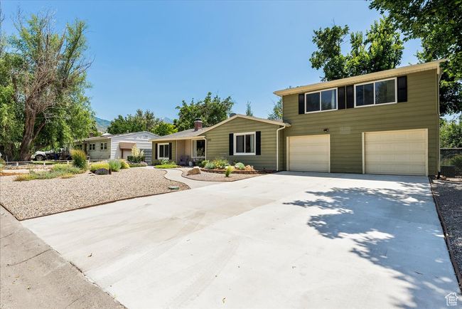 View of front of property with concrete driveway and an attached garage | Image 6
