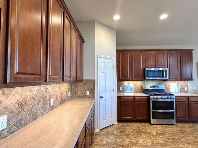 Plenty of counter space, undercabinet lighting. | Image 10