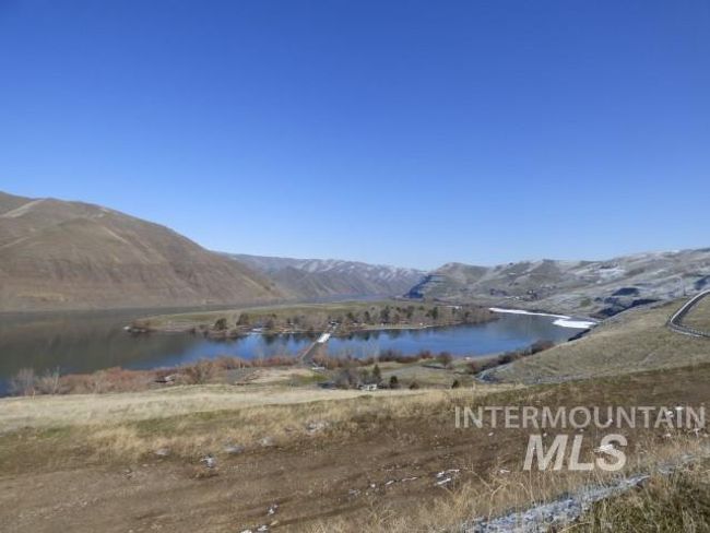 View of mountain backdrop with a large body of water | Image 39