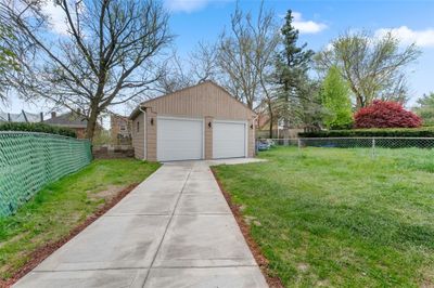 Yes, in Beechview there is a detached 2 car garage with new garage doors. The inside has been freshly painted. Looking to park your cars, bikes, extra storage. Look no further! Lucky You! Also, a fenced-in back yard, too! | Image 2