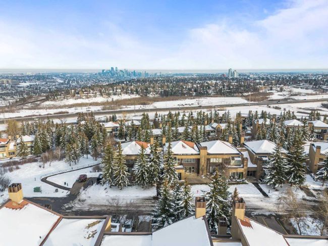 8 - 122 Village Heights Sw, Home with 2 bedrooms, 1 bathrooms and 2 parking in Calgary AB | Image 2