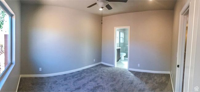 Spare room with a ceiling fan, baseboards, and carpet floors | Image 18
