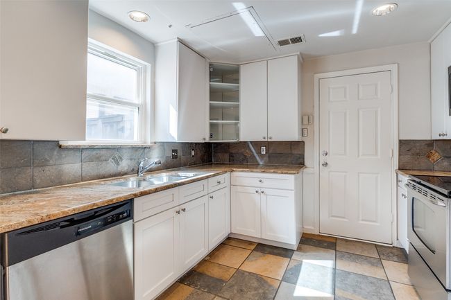 Door from kitchen to the Garage. | Image 10