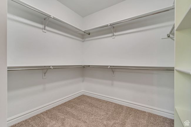 Walk in closet with carpet flooring | Image 19