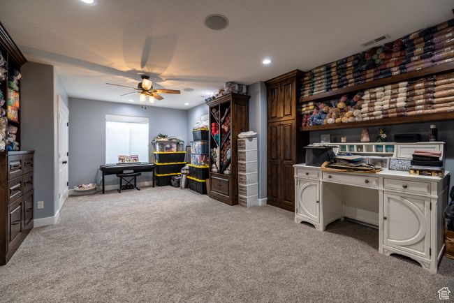 Carpeted home office featuring a ceiling fan and recessed lighting | Image 66