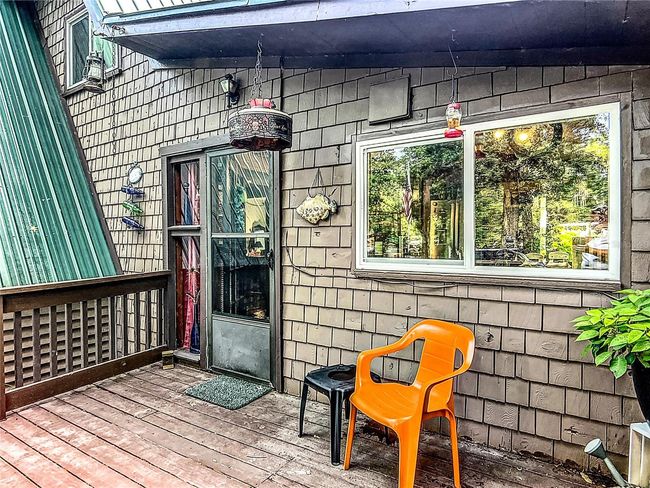 The side deck door leads to the kitchen. | Image 7