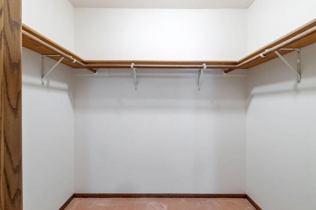 Primary walk-in closet. | Image 8