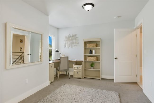 Extra space in the primary bedroom with room for an office set up or reading nook | Image 14