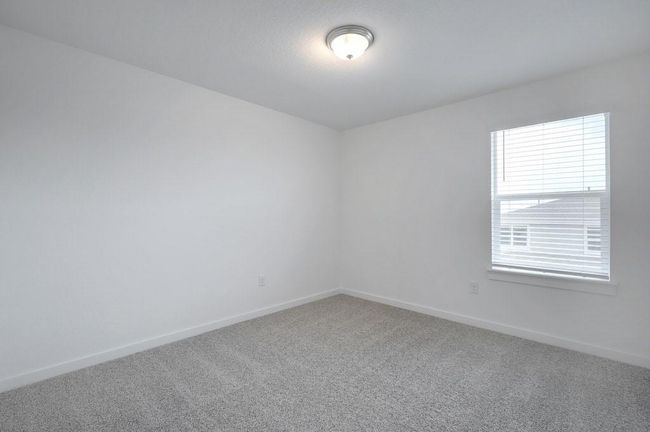 Carpeted empty room featuring baseboards | Image 6