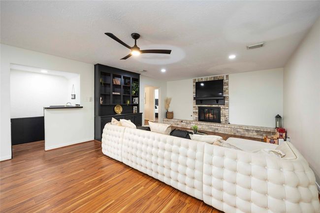 A compact bar area adjacent to the living room—perfect for entertaining guests or enjoying casual moments with friends and family. | Image 7