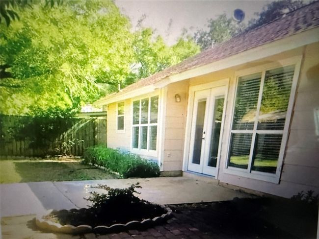 Doorway to backyard with a patio area and french doors | Image 25
