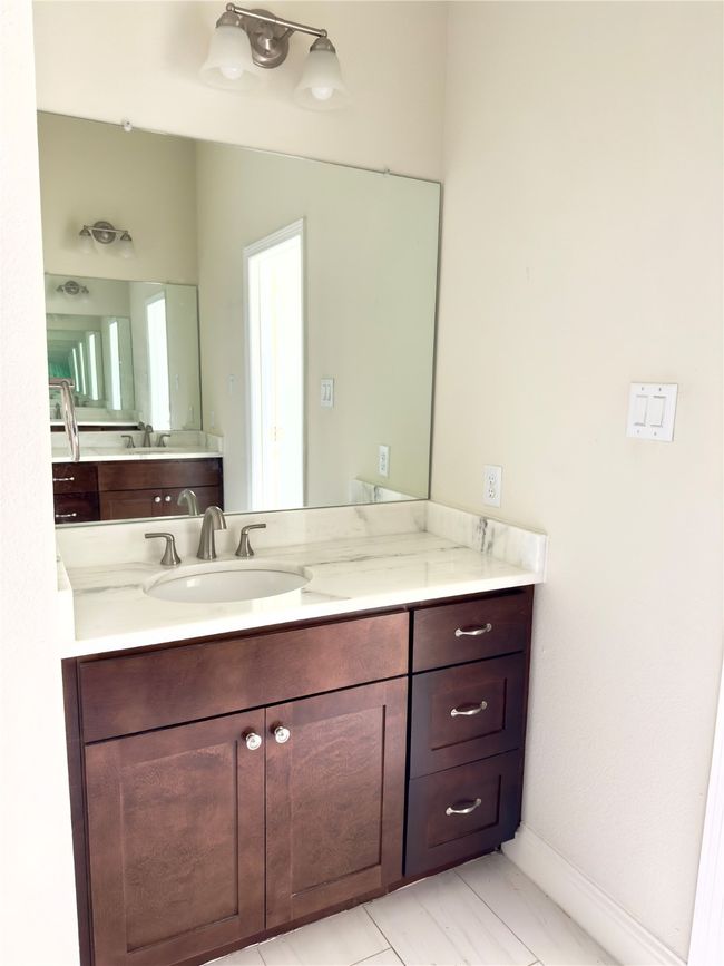 Bathroom with vanity and baseboards | Image 30