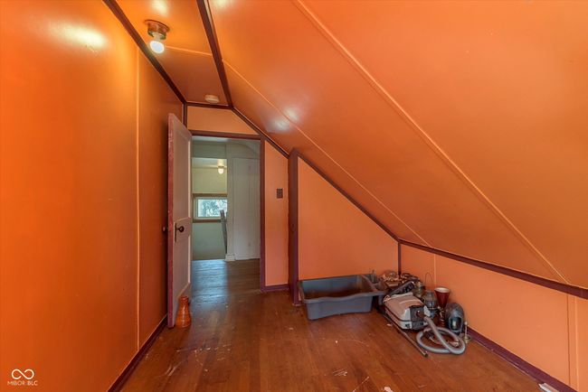 additional living space with hardwood / wood-style flooring and lofted ceiling | Image 22
