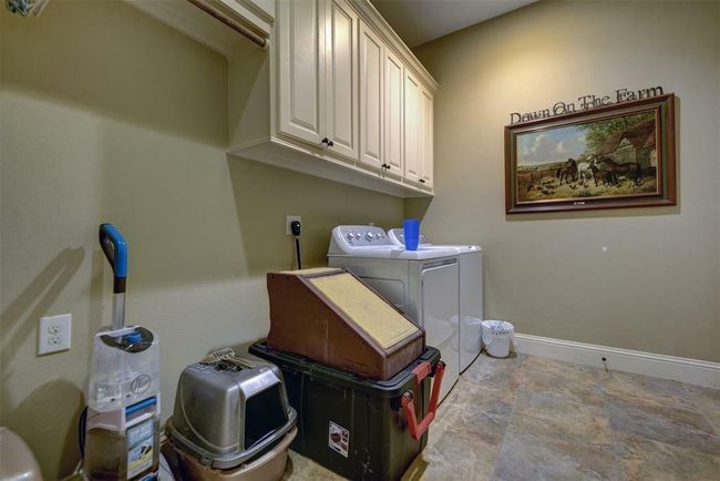 Large first floor laundry with direct access to the oversized garage. | Image 42