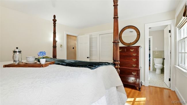 Bedroom with a closet, light wood-style flooring, and ensuite bathroom | Image 17