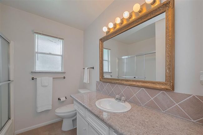 Guest bathroom with granite countertops. | Image 28