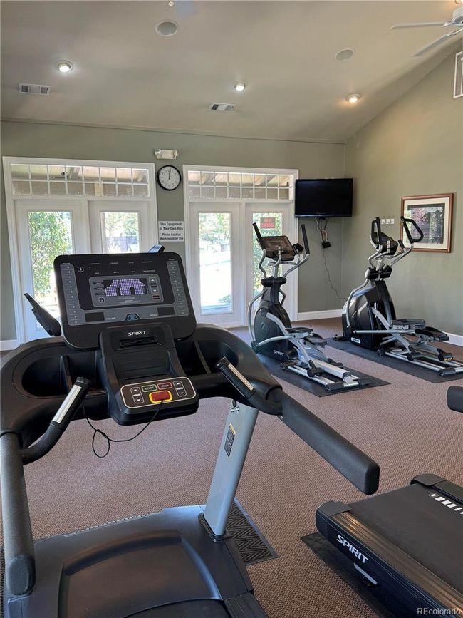 Additional view from the workout room, looking out towards the pool area. | Image 32