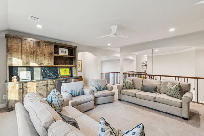 Upstairs bonus living area or flex space. Attached half bath. | Image 27