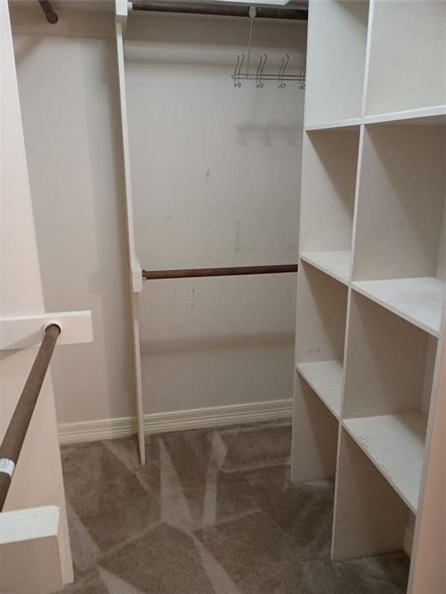 Large walk-in primary closet | Image 12