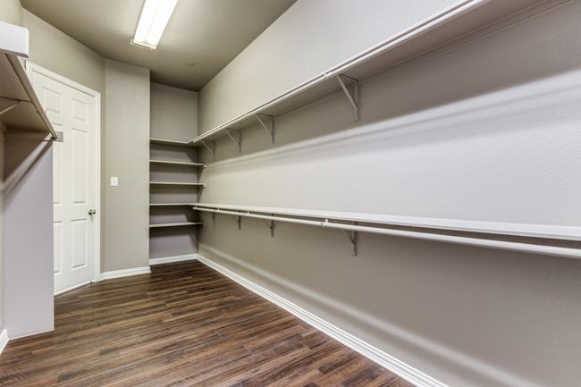 Spacious Primary bedroom closet with floors | Image 22