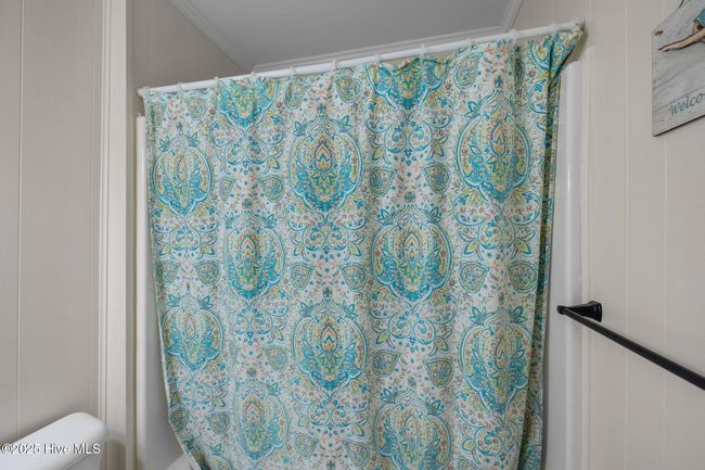Full bathroom with tub/shower located in hall on level 1 | Image 33