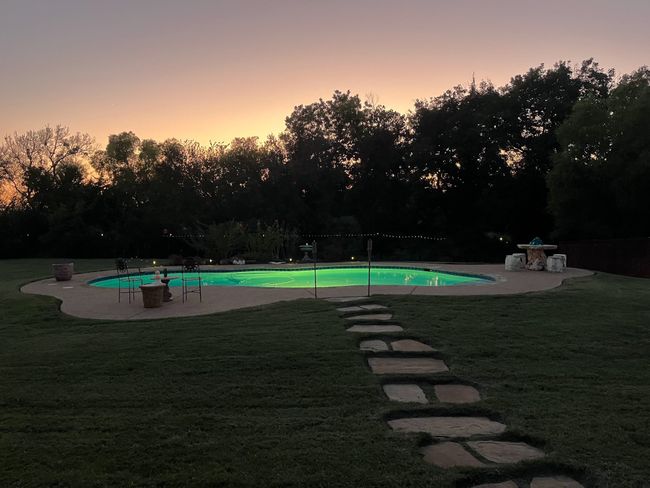 Pool with lights on at dusk | Image 25