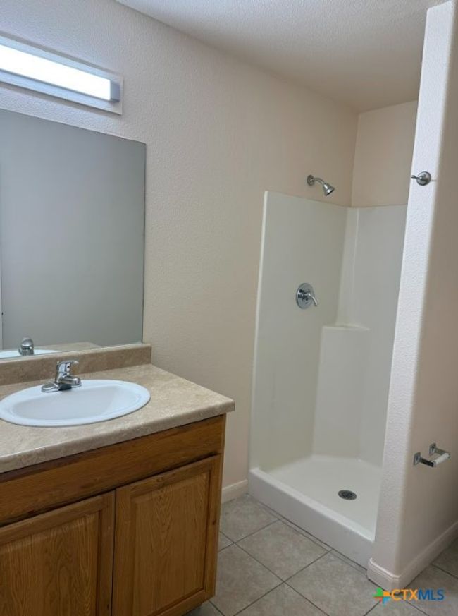 Another view of spacious bathroom with walk-in shower. | Image 32
